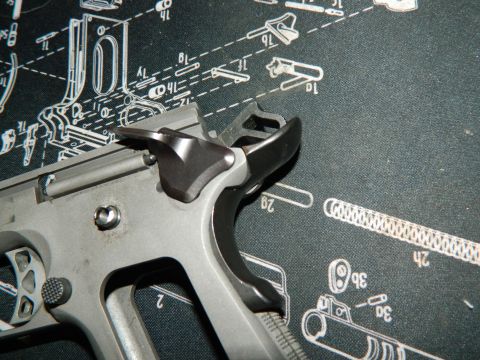 1979 Ford Bronco - Close-up of gun components laid out on a diagram mat.