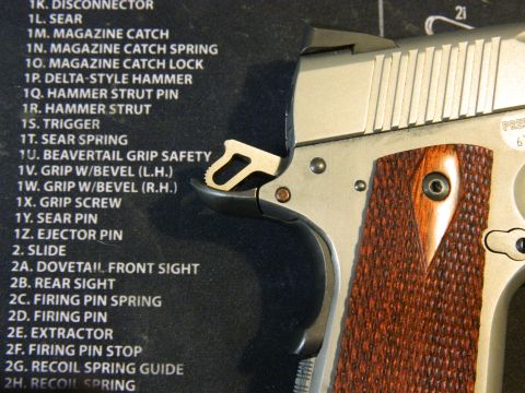 1979 Ford Bronco - A diagram lists various parts of a pistol, including the sear spring and grip safety, alongside a close-up view of the firearm's components.