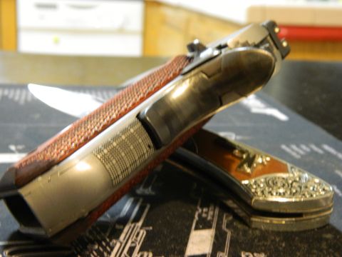 1979 Ford Bronco - Close-up view of two decorative knives with detailed handles, placed on a surface with technical drawings.