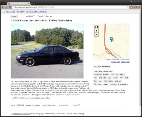 1993 Ford Taurus - This black 1991 Ford Taurus SHO is shown from the side, parked on asphalt with trees in the background.