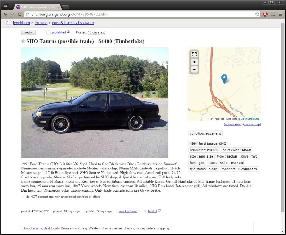 Black 1991 Ford Taurus SHO sedan parked outside