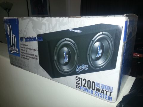 1994 Ford Bronco - Photograph of a vented dual 1200-watt subwoofer enclosure retail box, not a technical document.