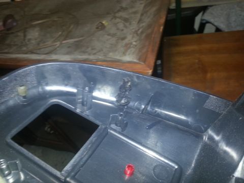 1994 Ford Bronco - Photograph of the rear side of a vehicle dashboard bezel, not a technical document.