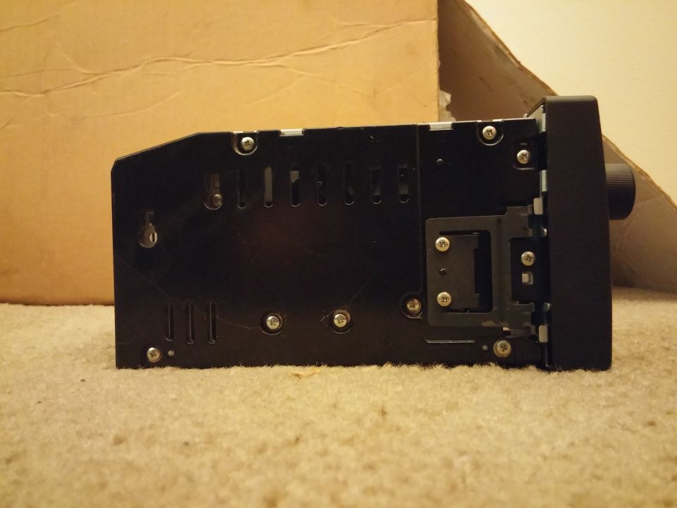 Side view photo of a car stereo head unit chassis