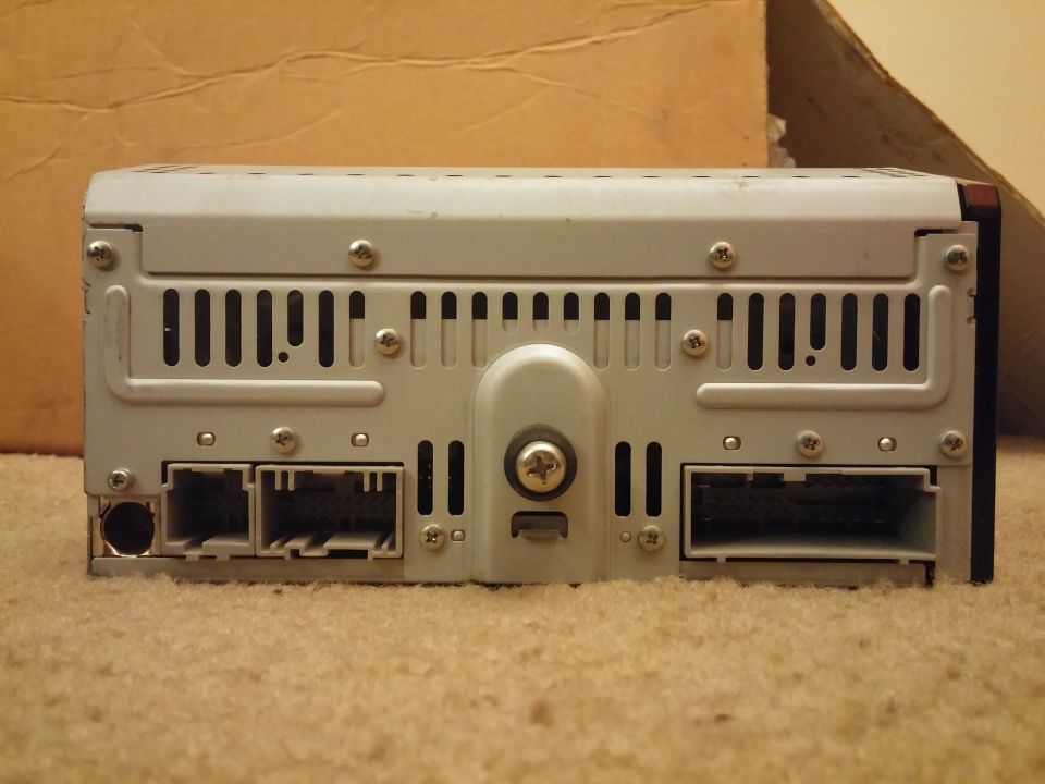 Rear view photo of a car stereo head unit showing connectors