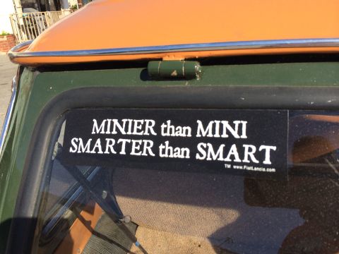 1968 Ford Mustang - Photograph of a humorous window decal on a small car, not a technical document.
