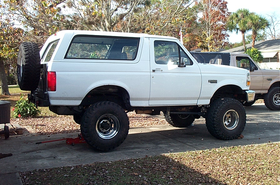 This rear tire/wheel combo is a Military  36x12.50/16.5 Goodyear Wrangler RT II on chrome 16.5x9.75 steel wheel. About 34.75" high and weighs 98 lbs.