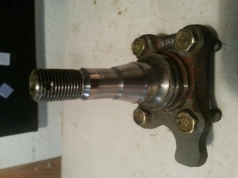 1991 Ford Festiva - This is a close-up of a metal wheel hub spindle, likely a replacement part for a vehicle.