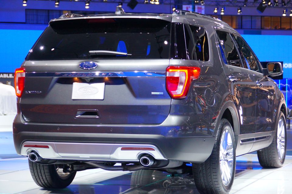 Rear view of a dark gray Ford Explorer SUV at an auto show.