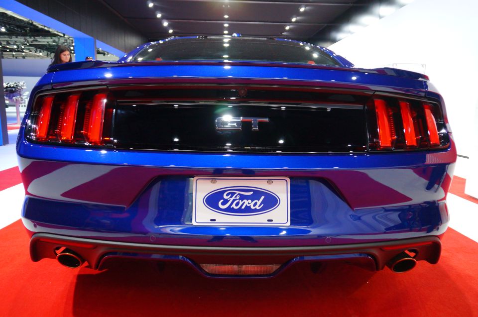 Blue Ford Mustang GT rear view with GT emblem and Ford license plate frame.