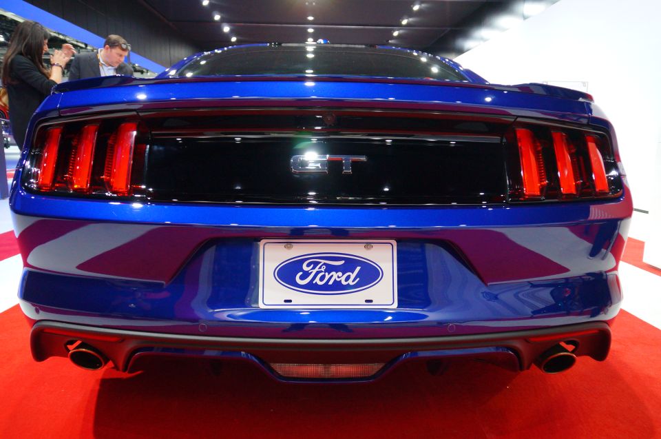 Blue Ford Mustang GT rear view with Ford license plate frame and GT badge.
