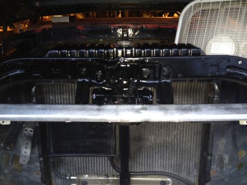 1978 Ford Bronco - Radiator and oil cooler assembly, likely from a classic vehicle, with a fan visible behind.