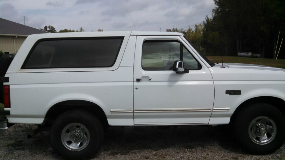 White 1995 Ford Bronco side view