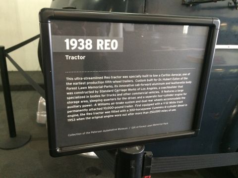 1968 Ford Mustang - Photograph of a museum exhibit placard for a 1938 REO tractor, not a vehicle technical document.