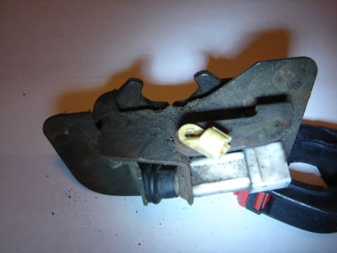 1996 Ford Bronco - This is a close-up of a vehicle door latch mechanism, showing its internal components and wiring.