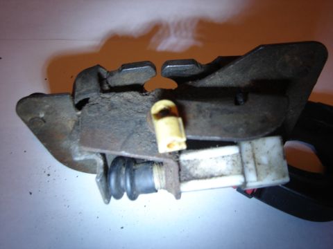 1996 Ford Bronco - Close-up of a vehicle door latch mechanism with visible wear and tear.