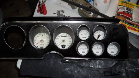1972 Ford Ranchero - This instrument cluster, likely from a 1972 Ford Ranchero, features a tachometer, speedometer, clock, and auxiliary gauges.