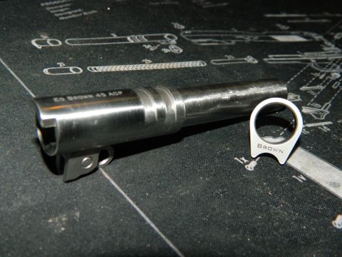 1979 Ford Bronco - Close-up of a gun barrel and a related part, both marked with text.