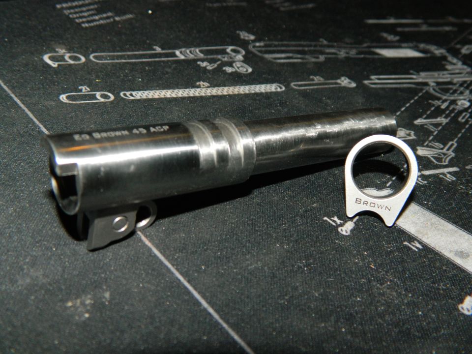 EG Brown 45 ACP gun barrel and BROWN ring part on a gun mat