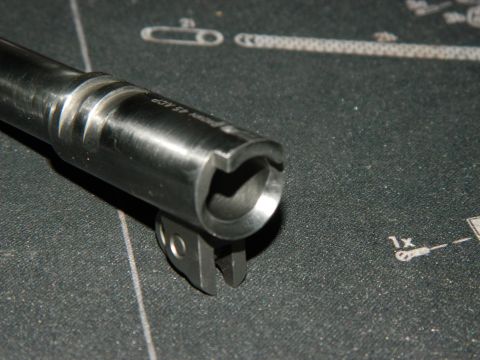 1979 Ford Bronco - A close-up view of a gun barrel, marked with caliber information, is shown on a textured mat.