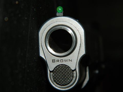 1979 Ford Bronco - Close-up of a gun barrel, showing the front sight and the engraving 'BROWN'.