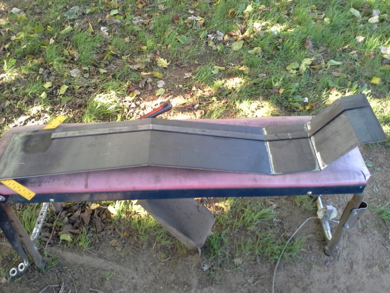 I started this with a 8" x 48" piece of A36 plate steel. Scored, bent and welded the plate to match my bent form.