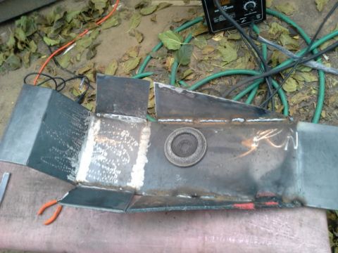 1993 Ford Bronco - Custom welded metal part, possibly for a vehicle's undercarriage, with welding marks visible.
