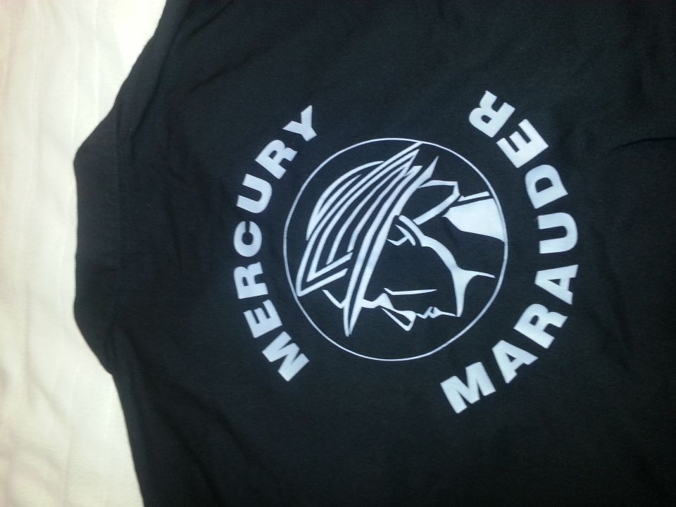 Black fabric with white Mercury Marauder logo and text