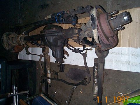 1981 Ford Bronco - A Dana 44 front axle assembly, likely for a 4x4 vehicle, is shown with its components.