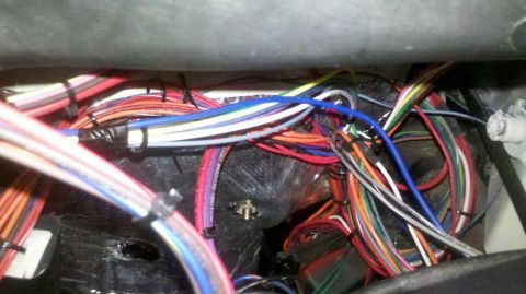 1982 Ford Bronco - Close-up of a complex vehicle wiring harness with many colored wires.