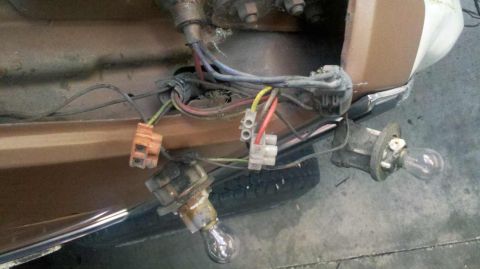 1982 Ford Bronco - This photo shows the exposed wiring and light bulb sockets of a vehicle, likely for repair or modification.