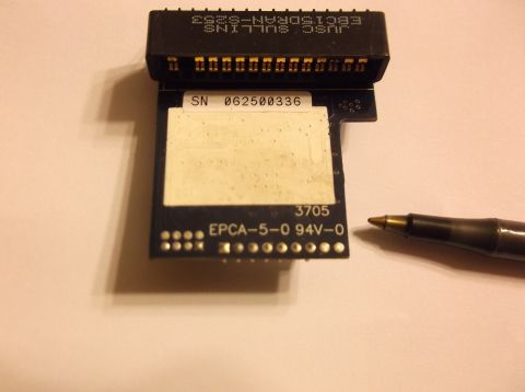 1979 Ford Ranchero - A black circuit board with white text and a white label is shown with a pen in the background. The circuit board has markings that include…