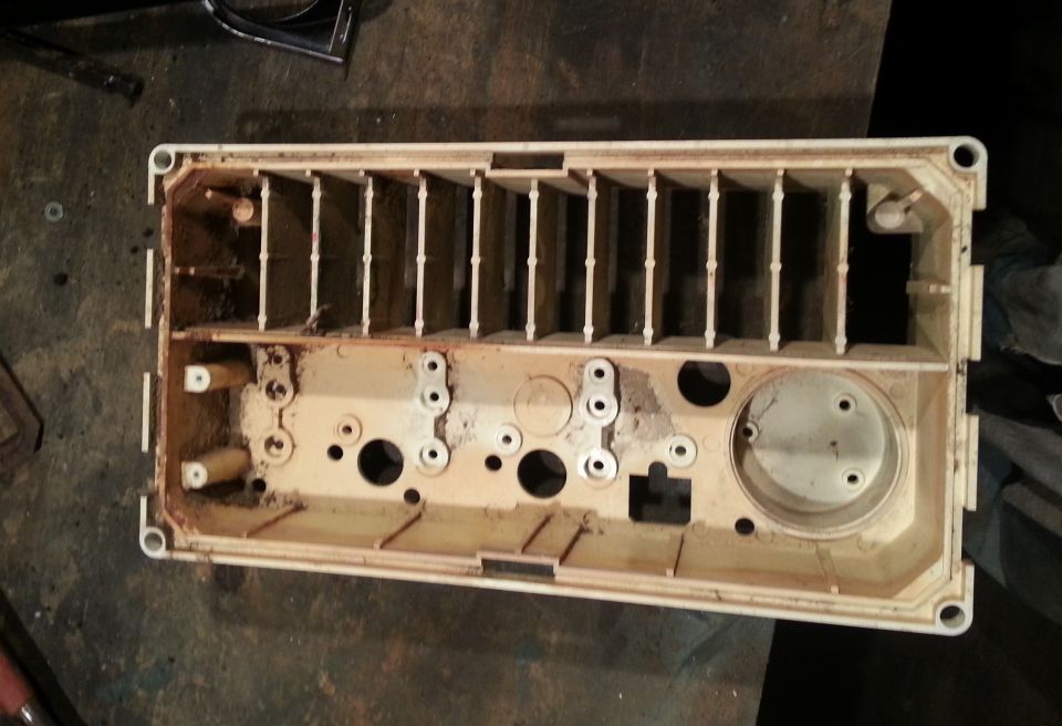 Disassembled cream plastic vehicle interior part with vents and mounting holes