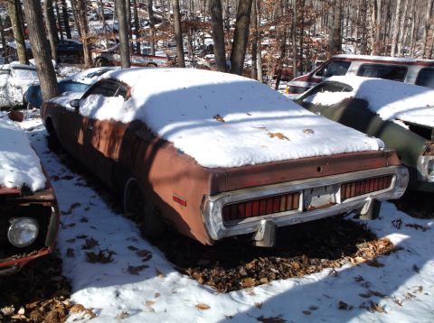 1974 Dodge Challenger - Junkyard find: a 1974 Dodge Challenger sits under a blanket of snow.