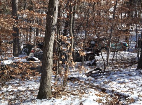 1974 Dodge Challenger - Multiple off-road vehicles are visible in a snowy, wooded environment.