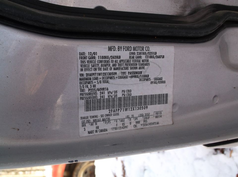 Door sticker with date 12/01 and VIN 2FAFP71W12X130509