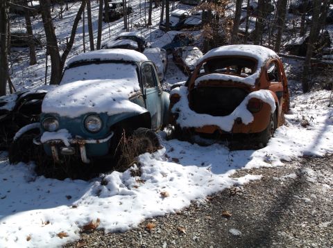 1974 Dodge Challenger - Junkyard scene with two snow-covered Volkswagen Beetles.