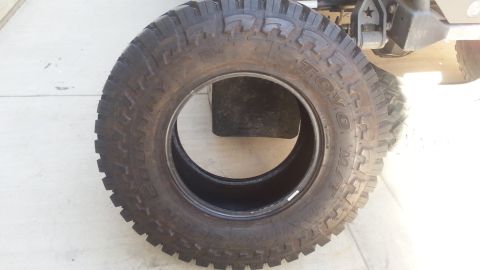 1997 Ford Ranger - A close-up view of a tire with visible lettering, attached to a vehicle.