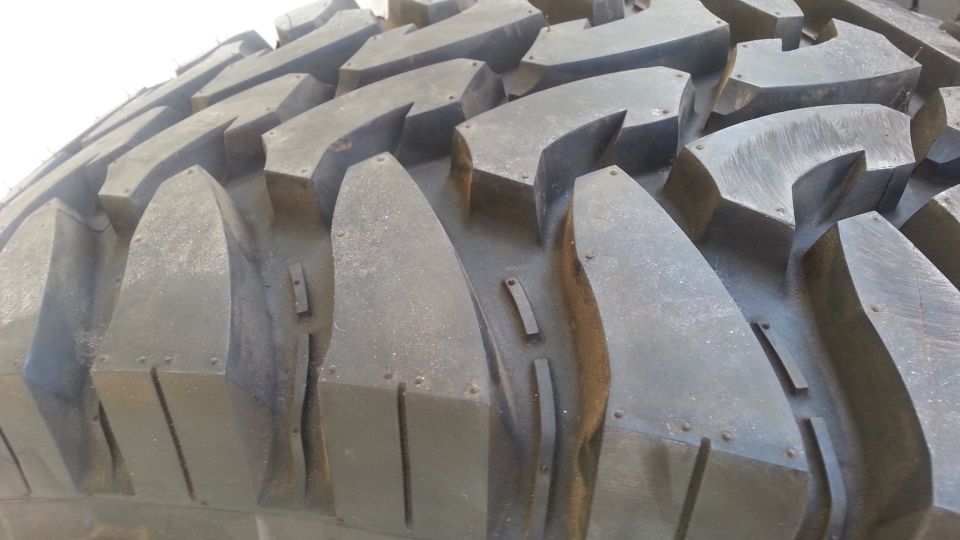 Close-up of aggressive off-road tire tread pattern