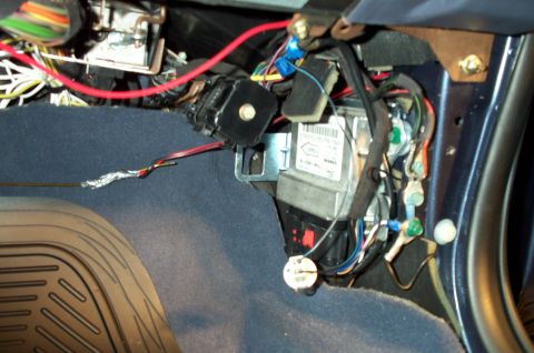 1998 Ford Crown Victoria - I used a coat hanger to snake the new power and ground wires through the door into the passenger compartment.