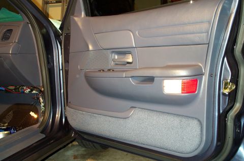 1998 Ford Crown Victoria - The passenger door, now with illuminated courtesy lamps. You can also see the floor courtesy lamp that I installed in this pic.