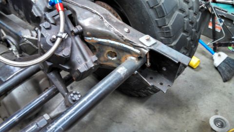 1967 Ford F-250 - Detail of a Ford steering box and custom frame modifications, likely for a project vehicle.