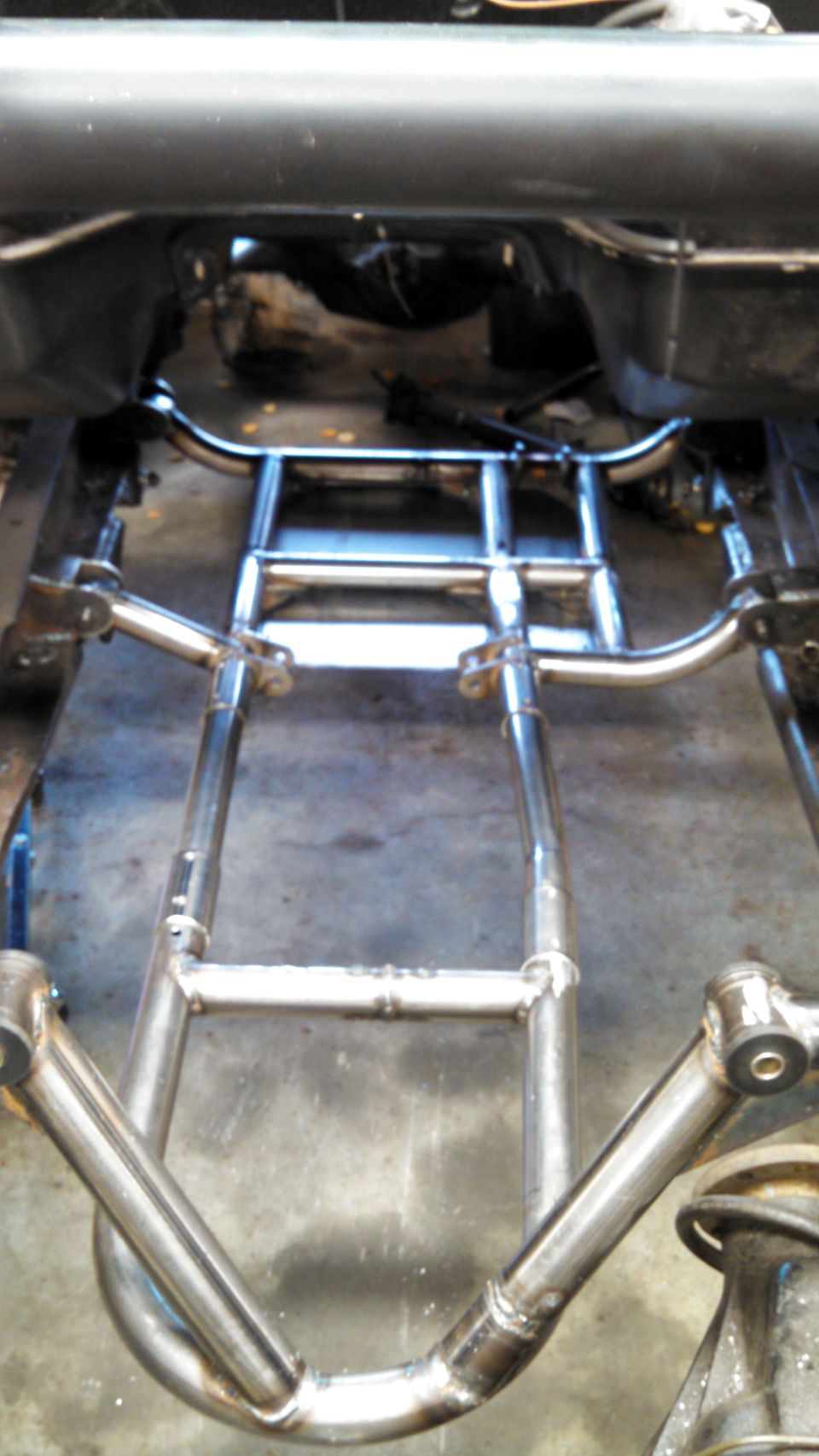 Custom exhaust system on vehicle frame
