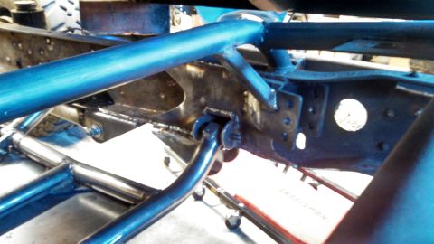 1967 Ford F-250 - Custom chassis fabrication work is underway, showing welded metal components and blue tubing.