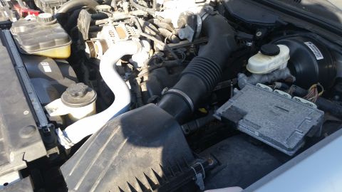 1991 Ford LTD Crown Victoria - Close-up view of the engine compartment, showing components like the air intake and brake fluid reservoir.