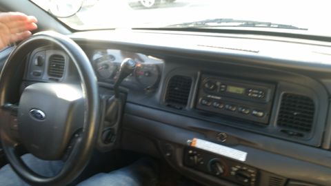 1991 Ford LTD Crown Victoria - The interior of a 1991 Ford Crown Victoria LTD shows the dashboard, steering wheel, and radio.