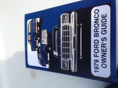 1979 Ford Bronco - The cover of the 1979 Ford Bronco owner's guide features an illustration of the vehicle's front grille and headlights.