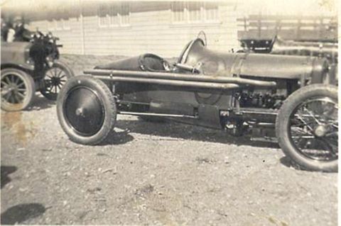 1909 Ford Model T - This 1909 Ford Model T speedster is parked next to another early automobile.