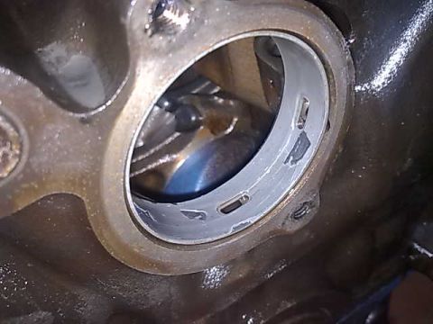 1972 Ford Ranchero - This image shows a damaged engine bearing, likely from an internal engine component failure.