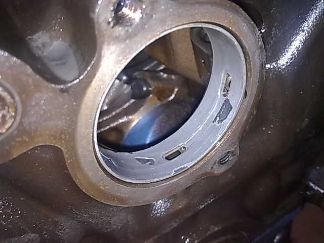 Close-up of a damaged engine bearing
